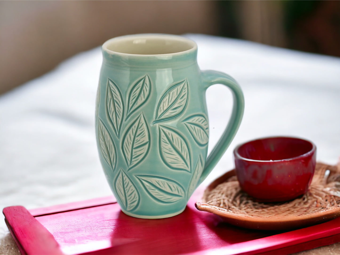 Large porcelain mug with leaf carvings in turquoise