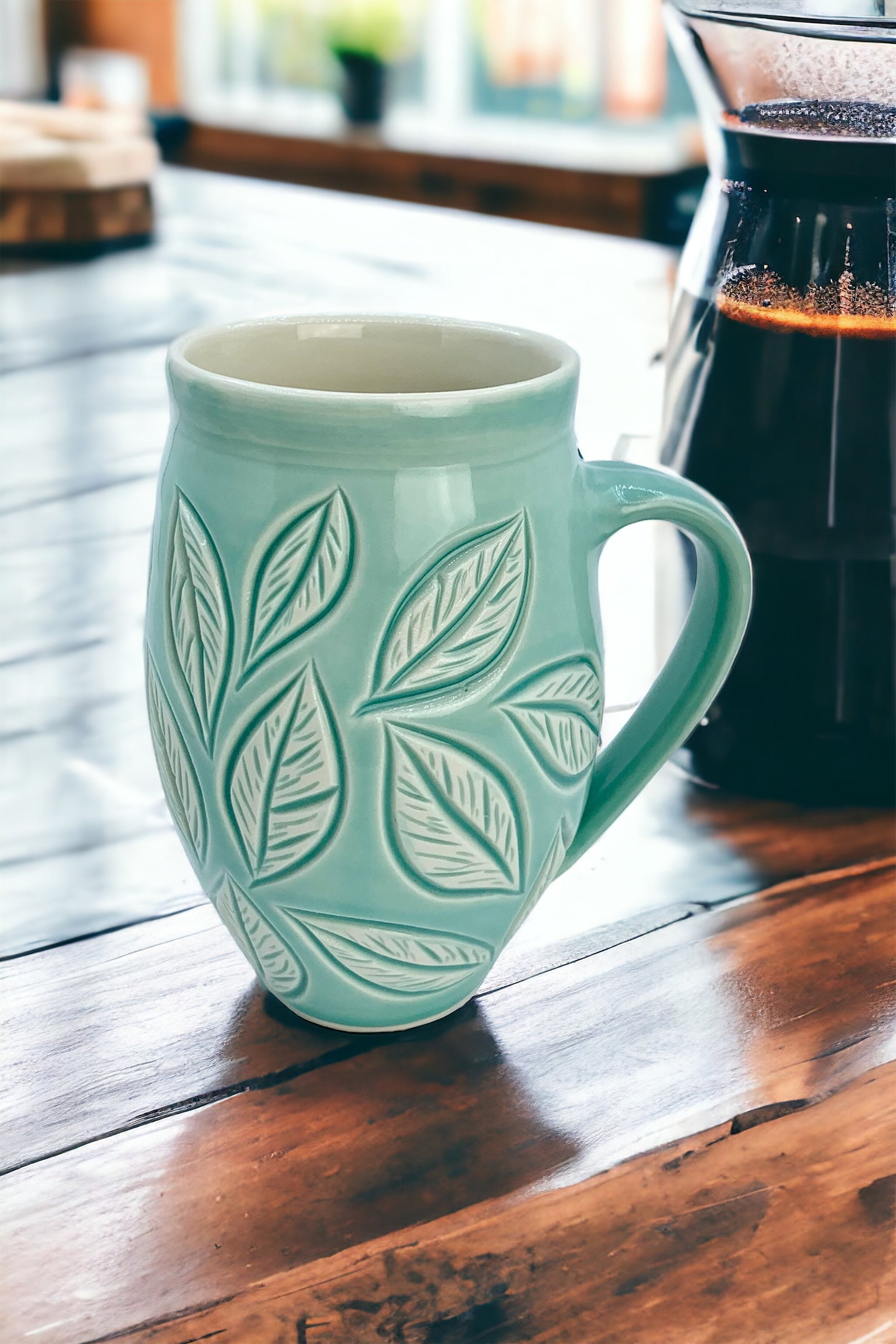 Large porcelain mug with leaf carvings in turquoise