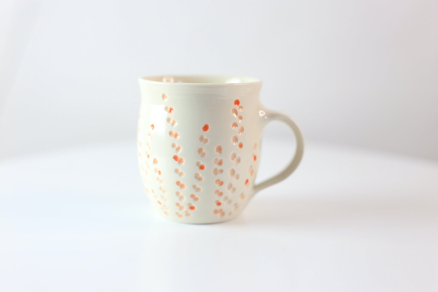 Porcelain mug with abstract floral carvings