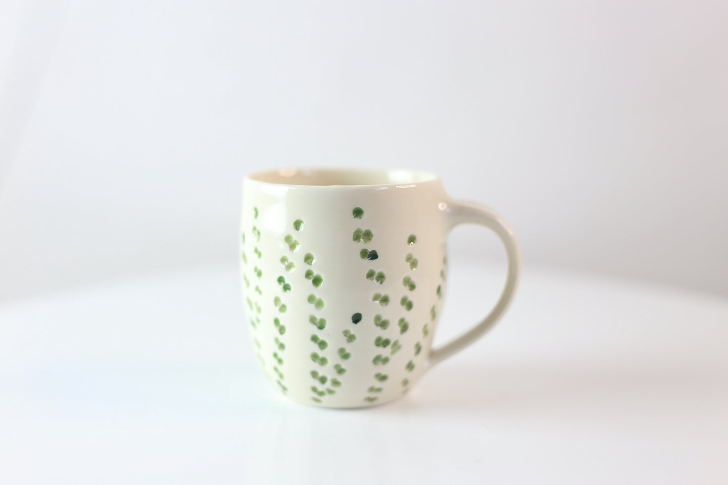 Porcelain mug with abstract floral carvings