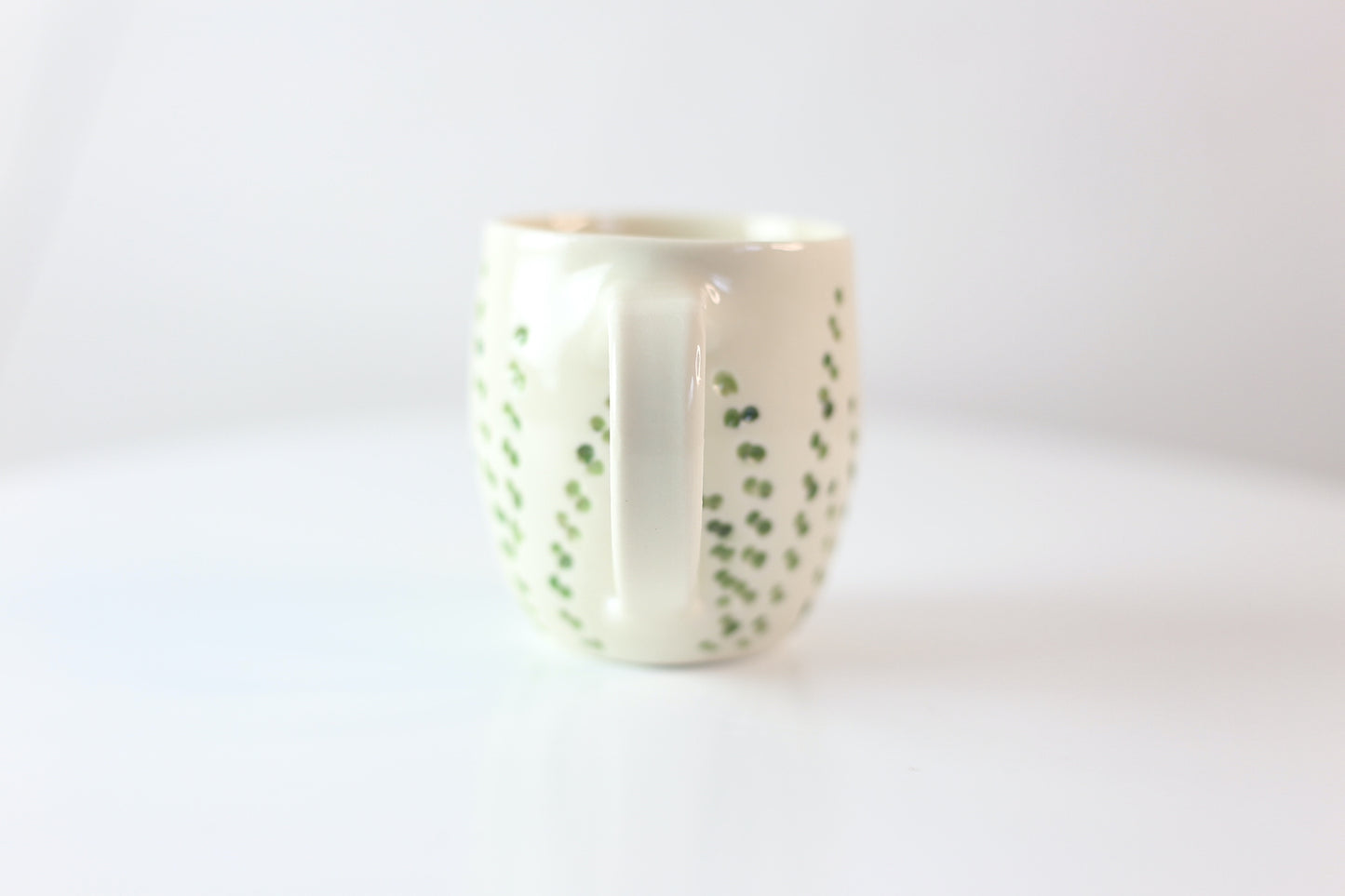 Porcelain mug with abstract floral carvings