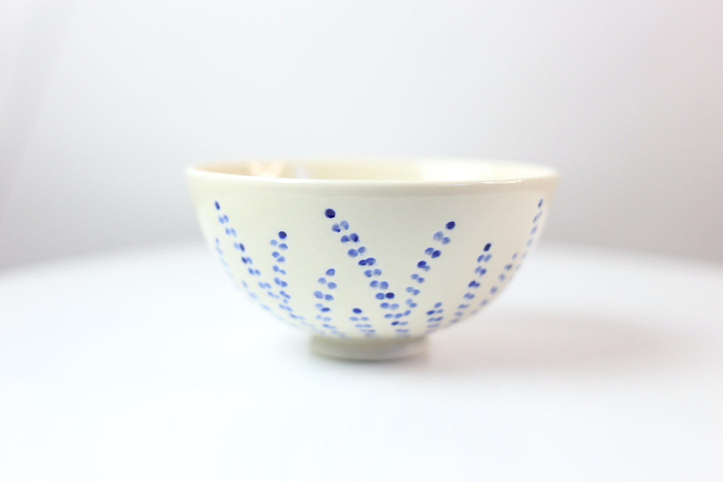 Hand-carved and painted medium porcelain bowl