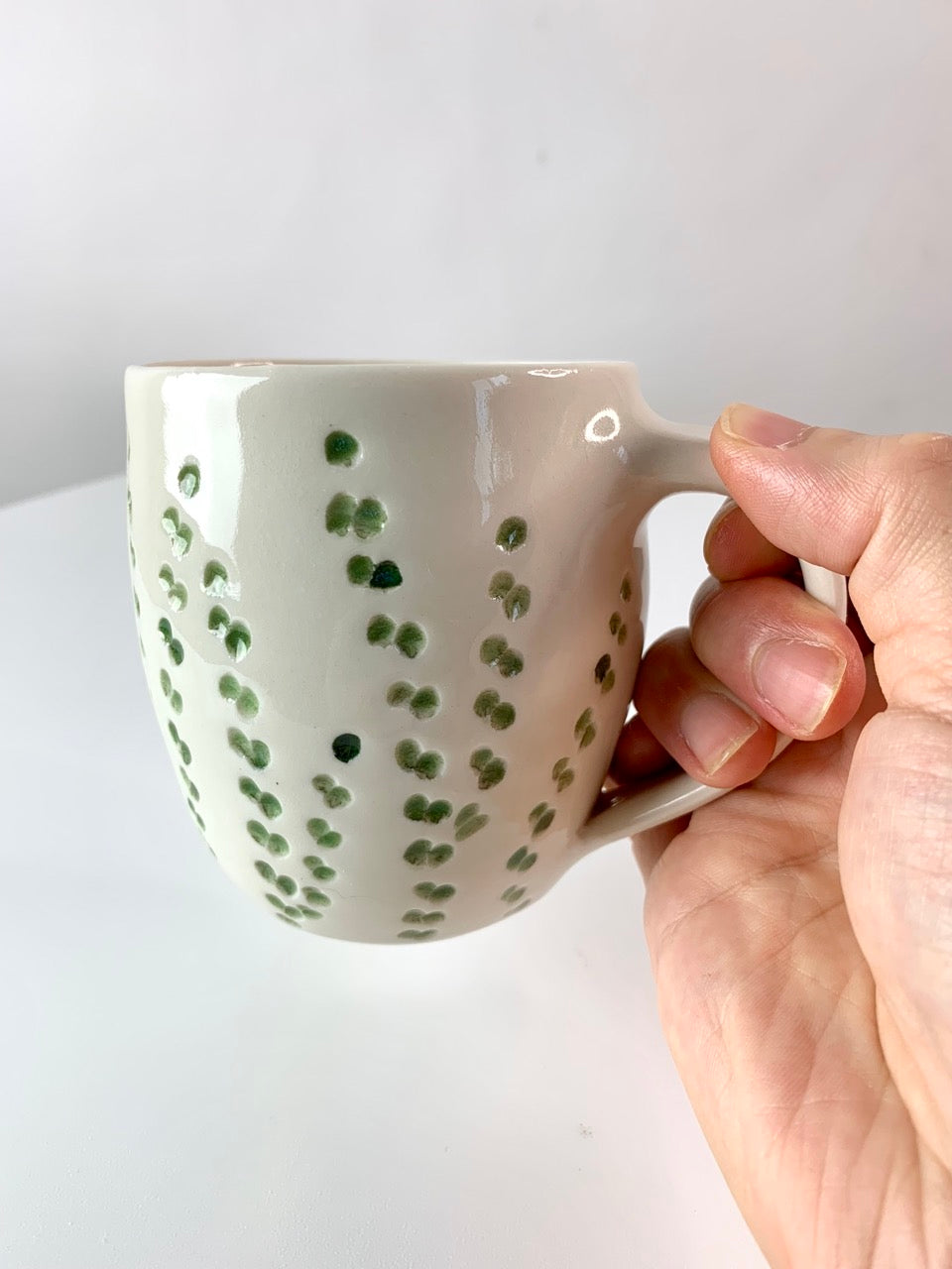 Porcelain mug with abstract floral carvings