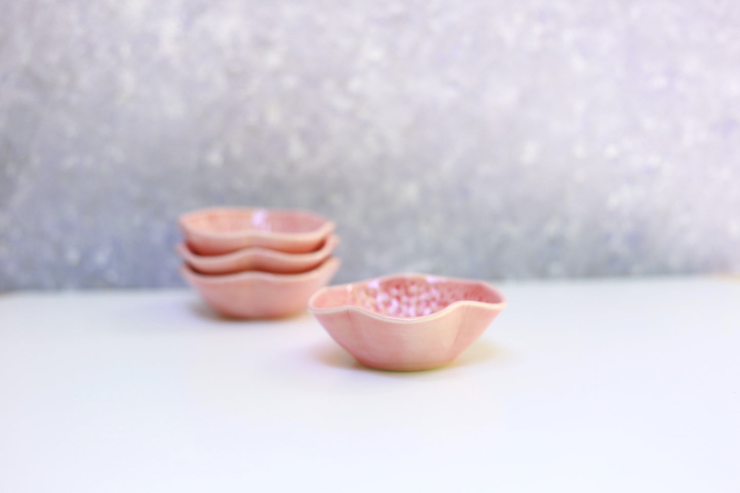 Small porcelain bowl with carvings in coral color