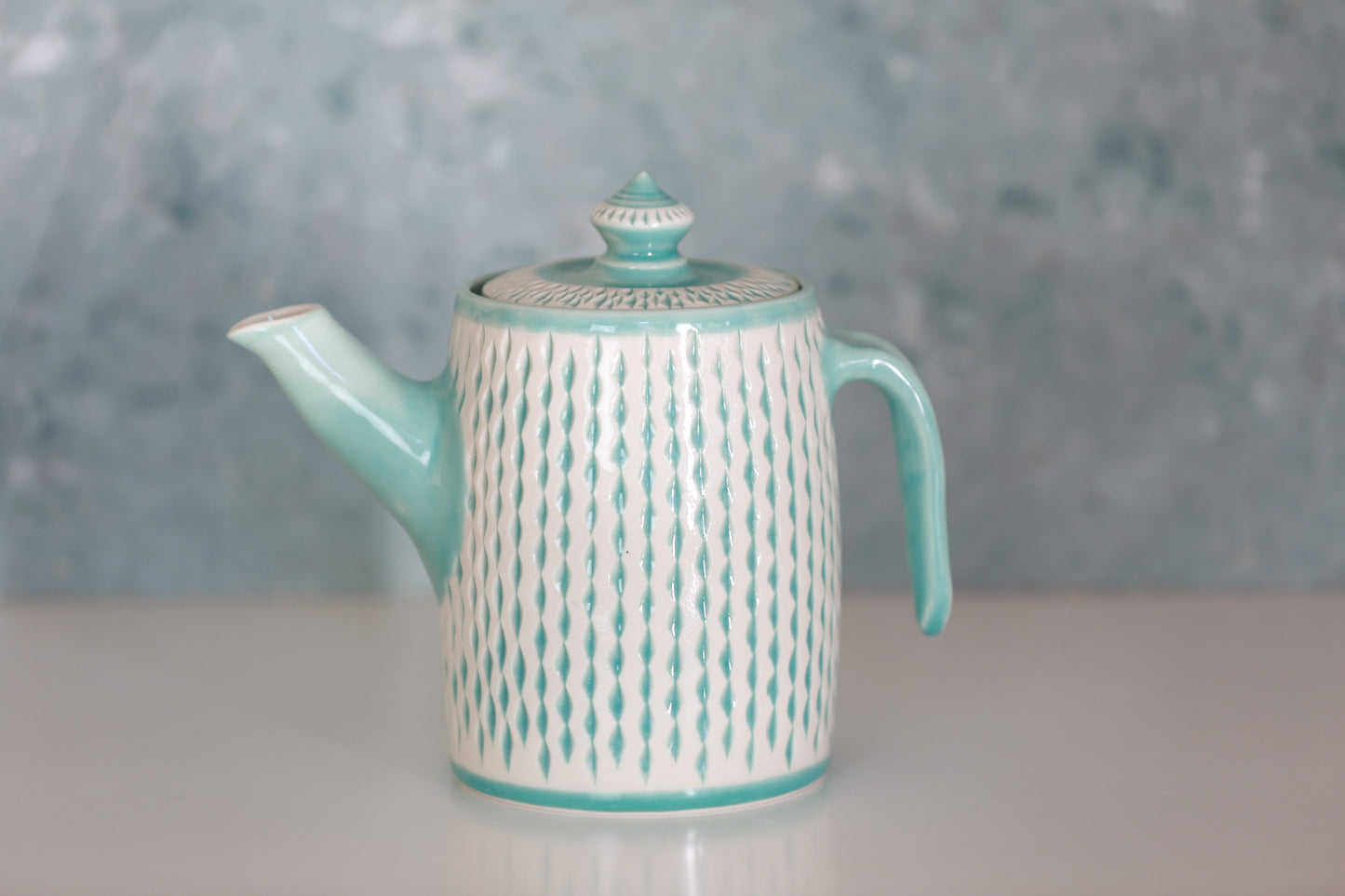 Large Porcelain teapot with carvings in turquoise