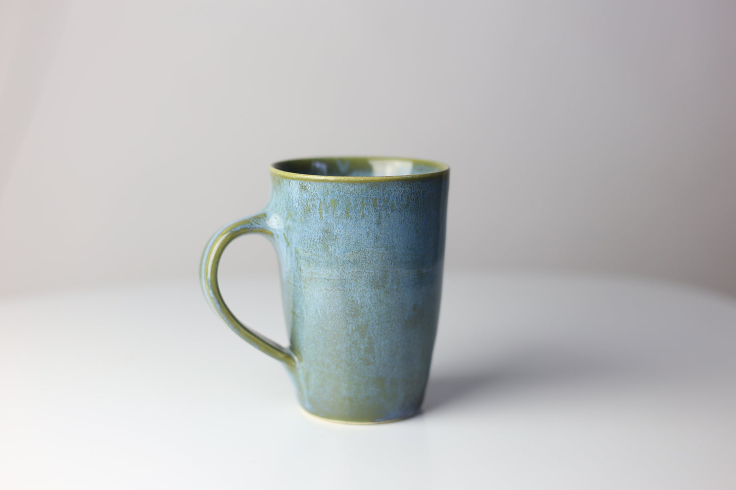 Elegant 8-10 oz stoneware mug in blue green