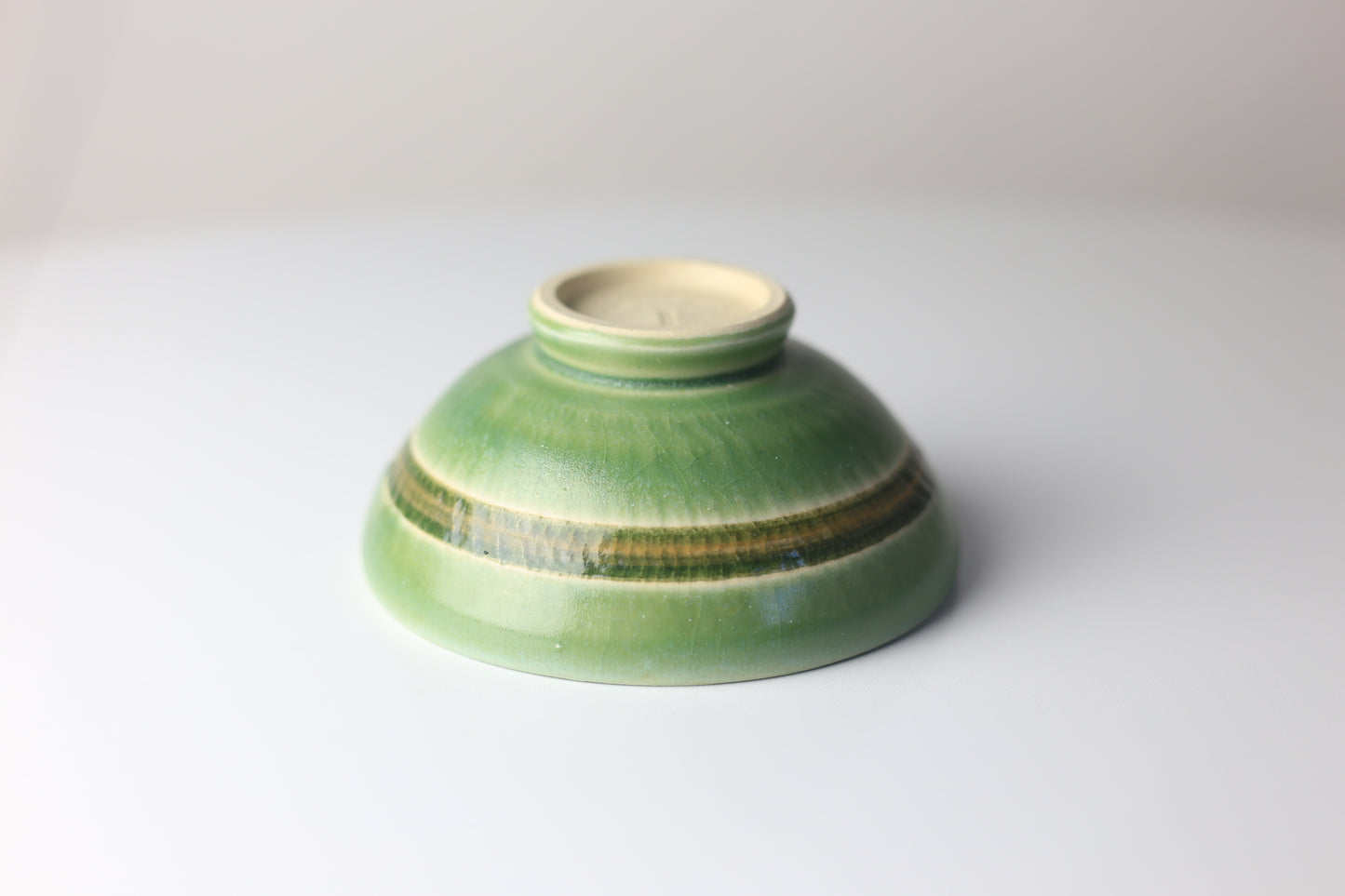 Small green stoneware bowl with chattering design #50