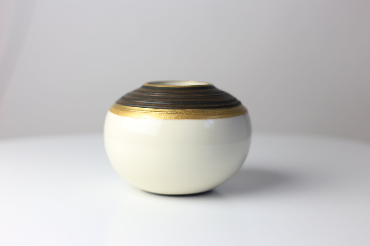 Round porcelain vase with gold accent #10