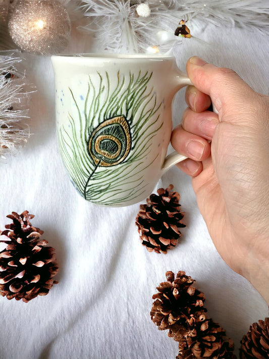 Porcelain mug with peacock feathers