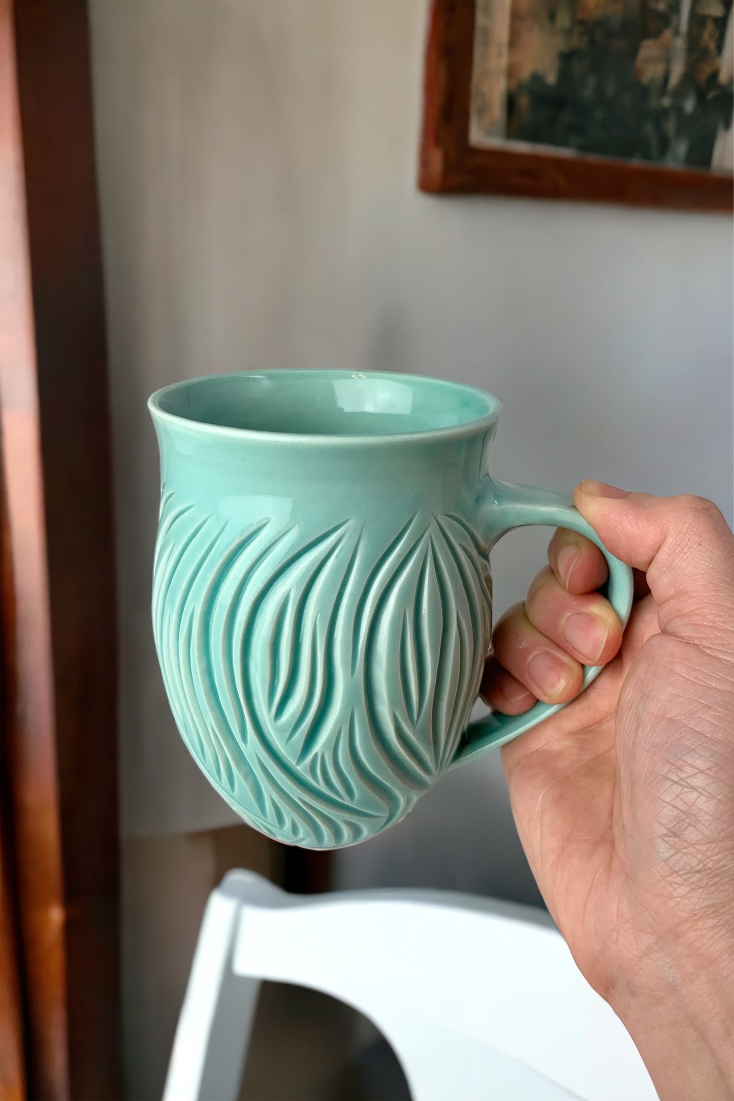 Large porcelain mug with abstract carvings in turquoise