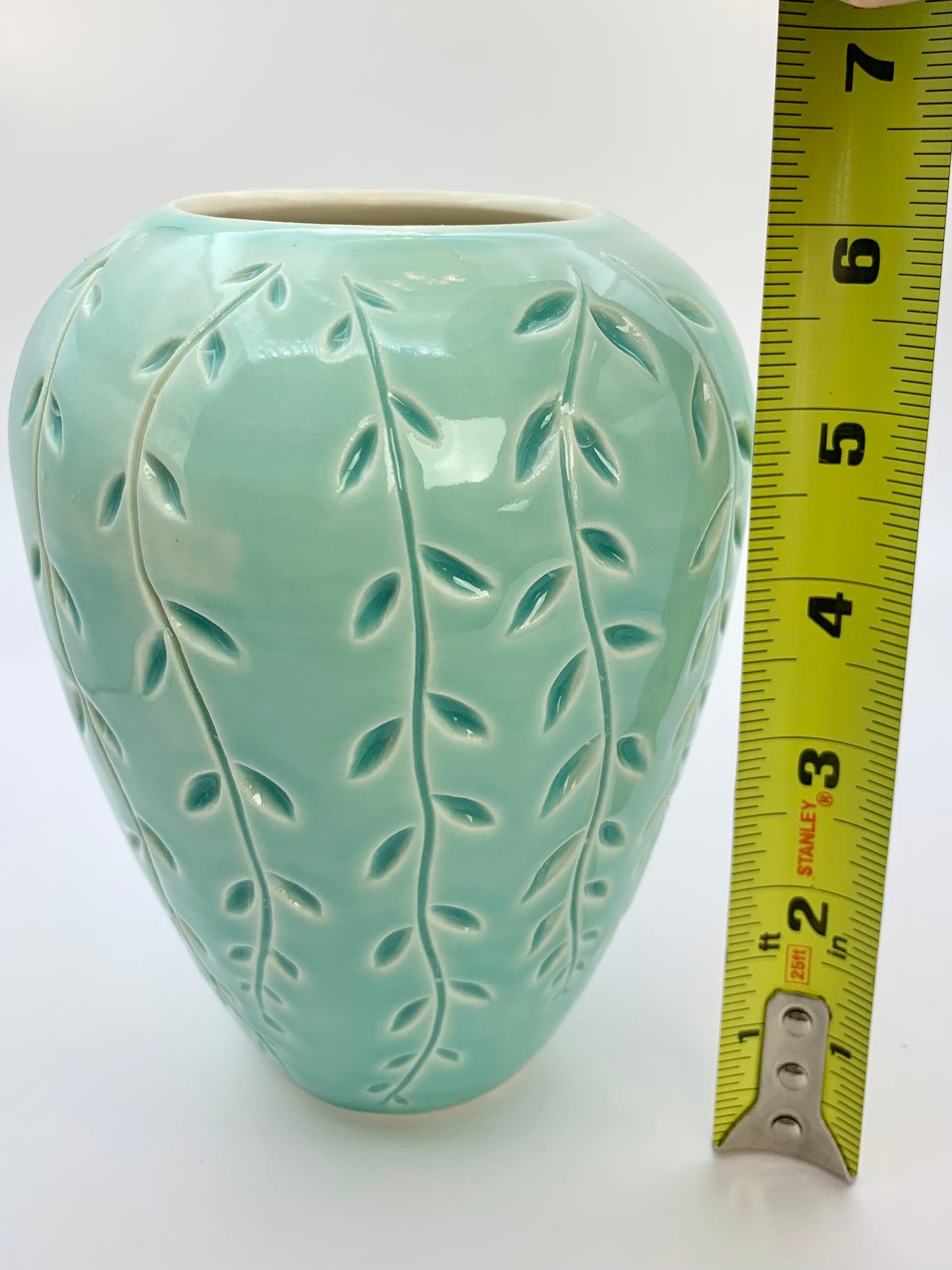 Porcelain vase with vine carvings in turquoise