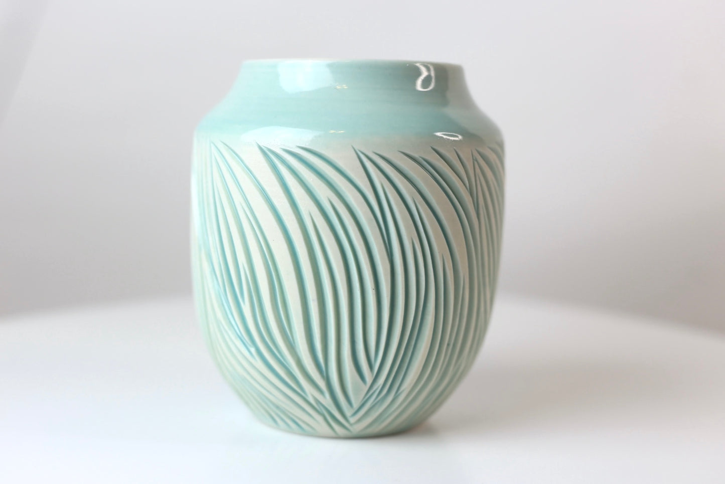 Porcelain vase with abstract carvings in turquoise