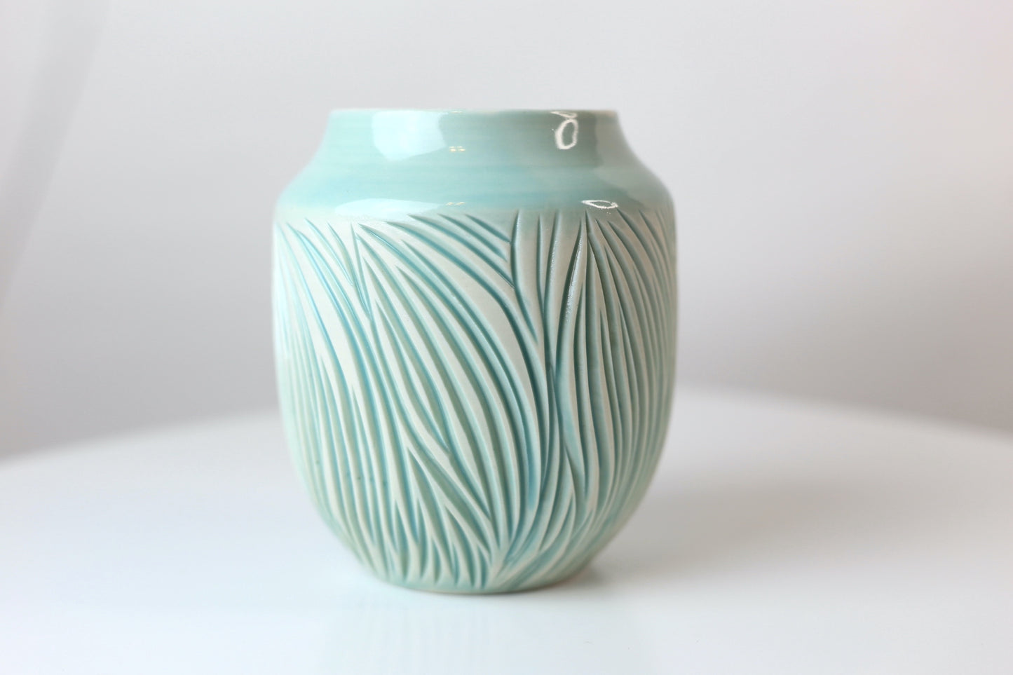 Porcelain vase with abstract carvings in turquoise