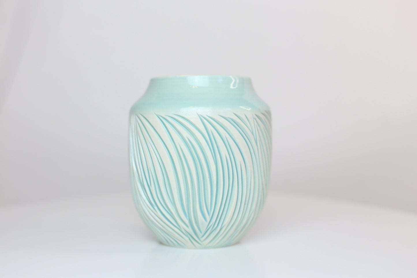 Porcelain vase with abstract carvings in turquoise