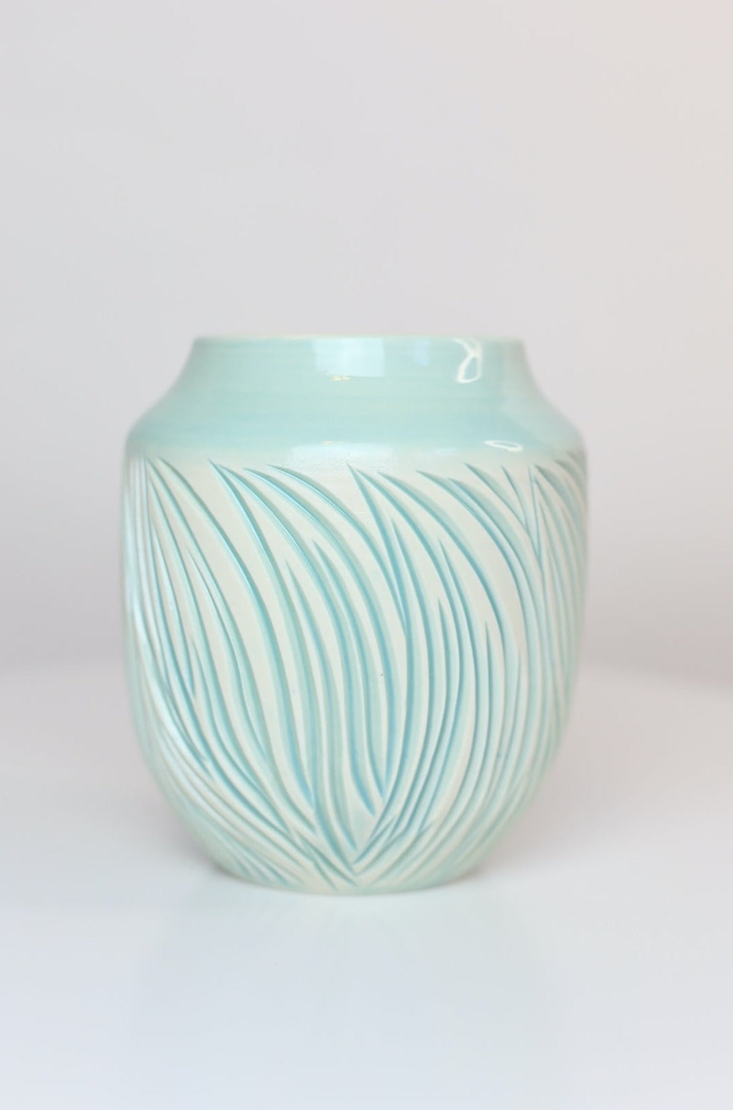 Porcelain vase with abstract carvings in turquoise