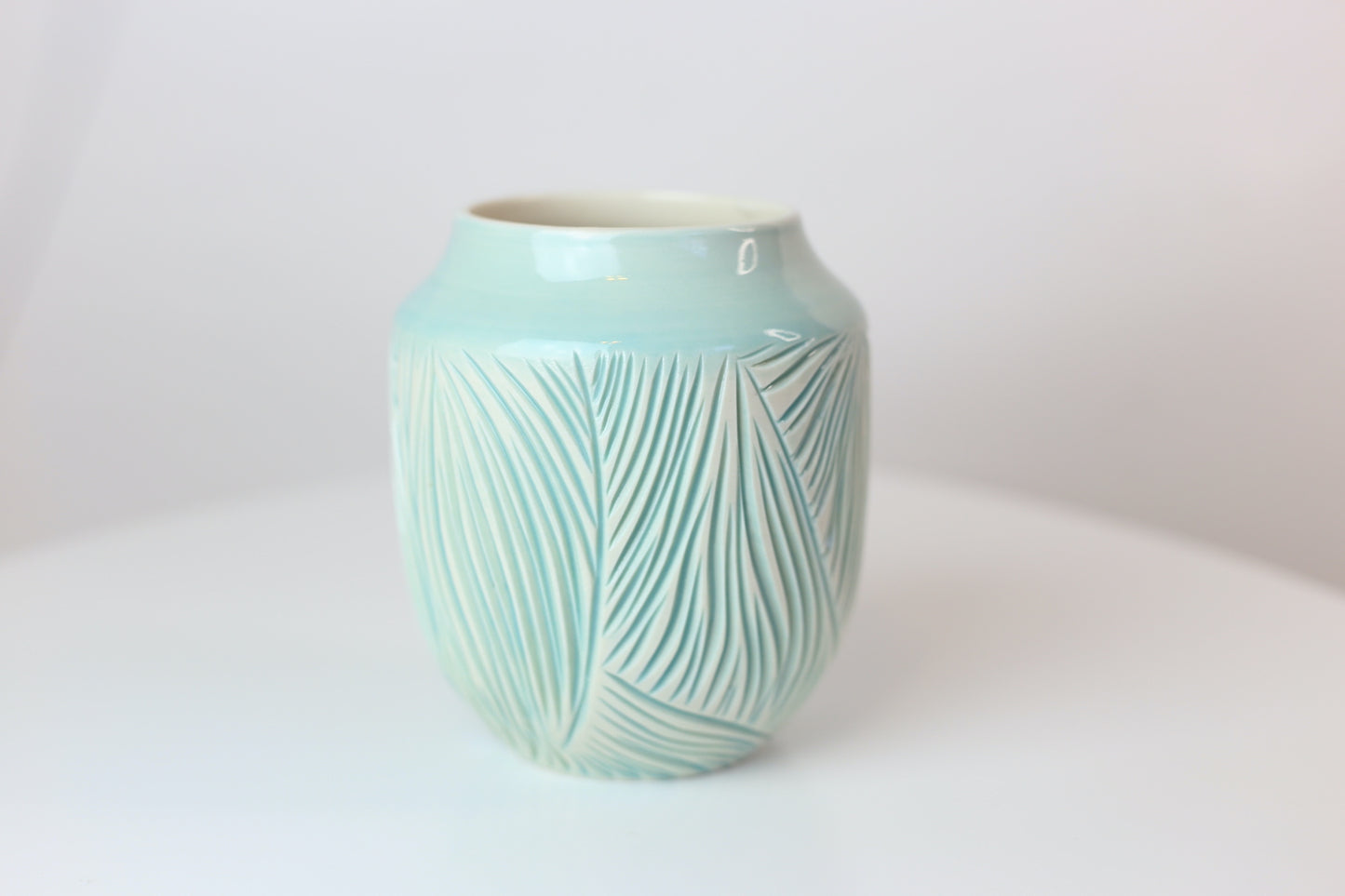 Porcelain vase with abstract carvings in turquoise