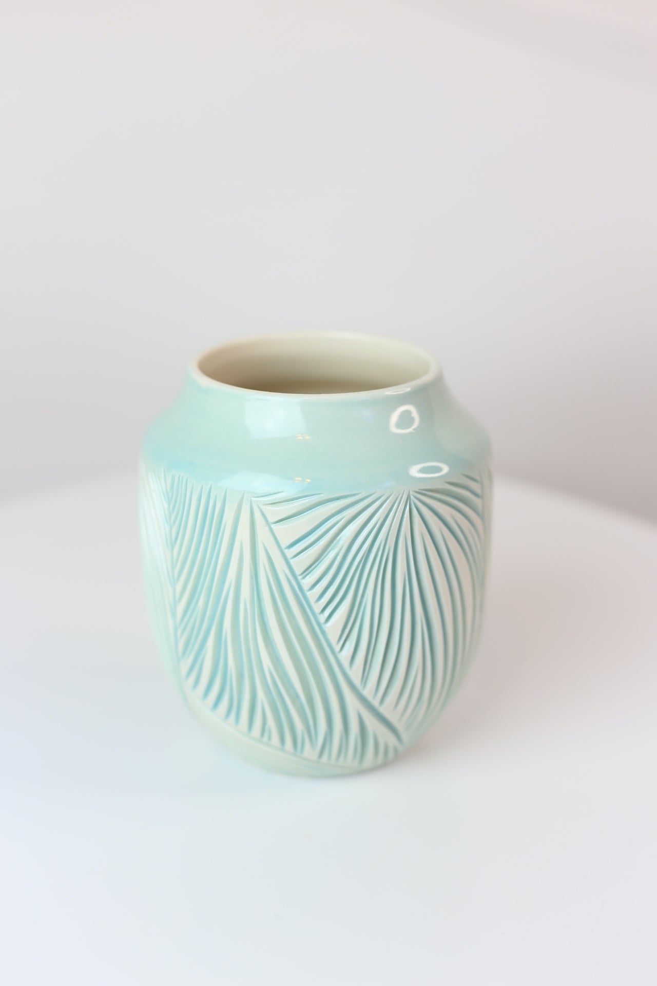 Porcelain vase with abstract carvings in turquoise