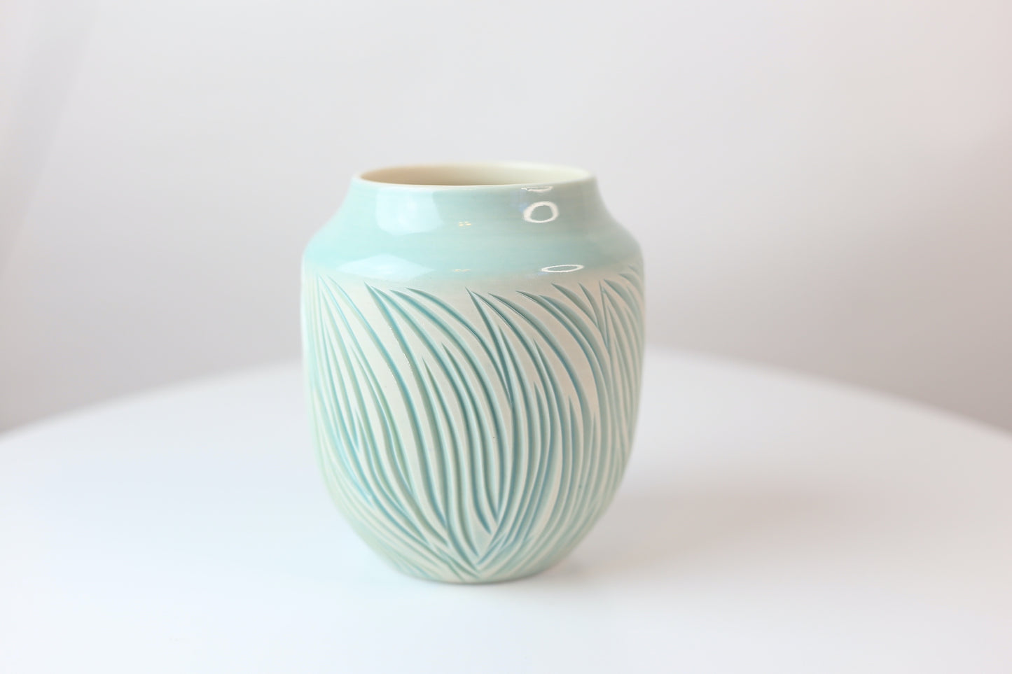 Porcelain vase with abstract carvings in turquoise