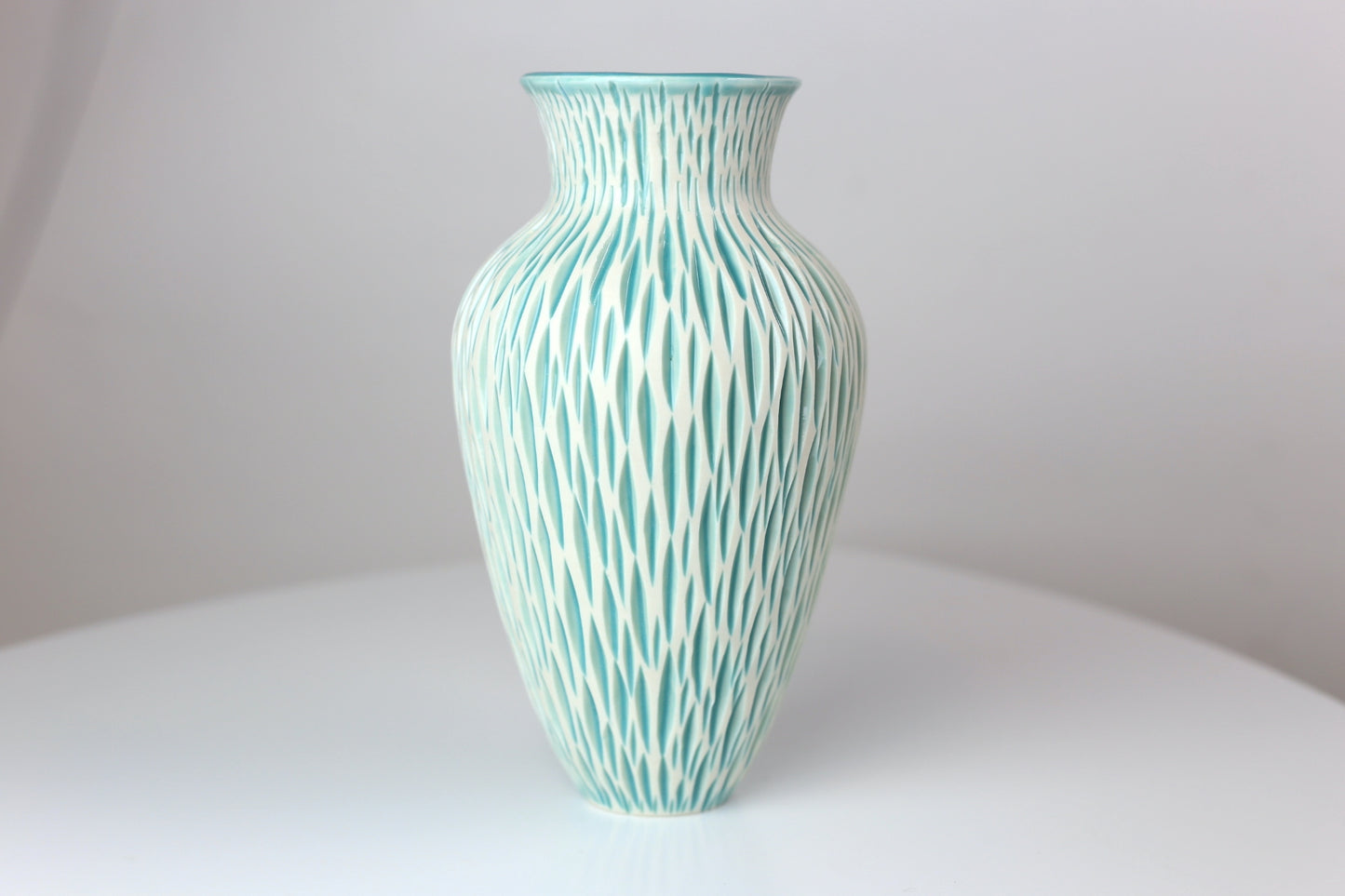 Porcelain vase with geometric carvings in turquoise