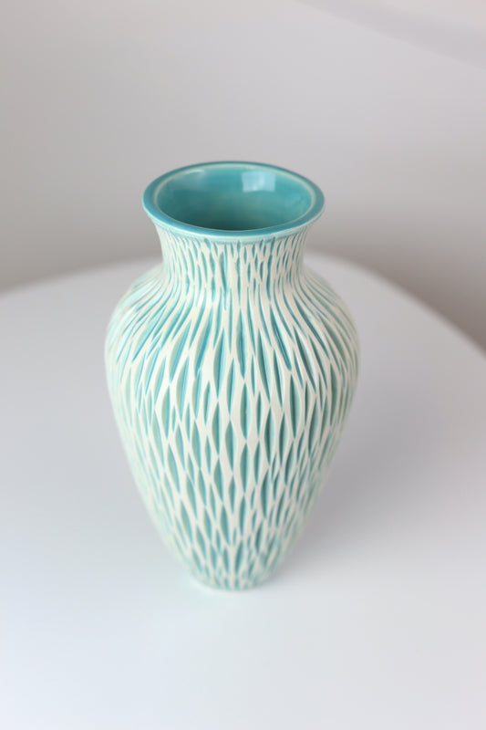 Porcelain vase with geometric carvings in turquoise