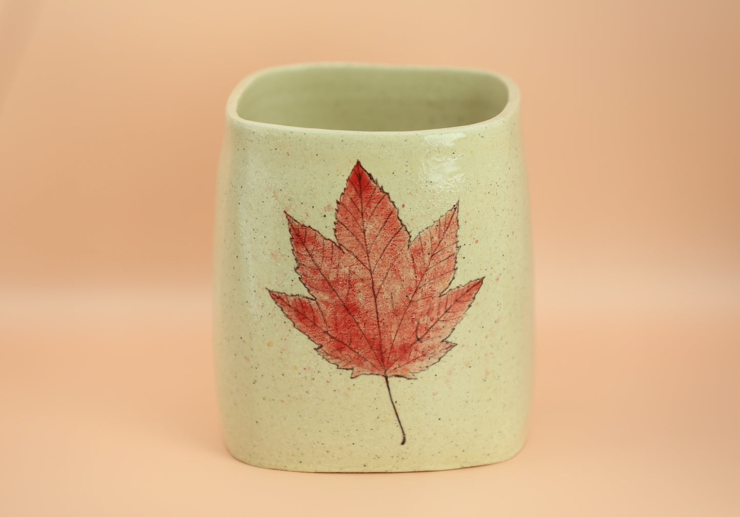 Ceramic utensil holder with handpainted leaf motif