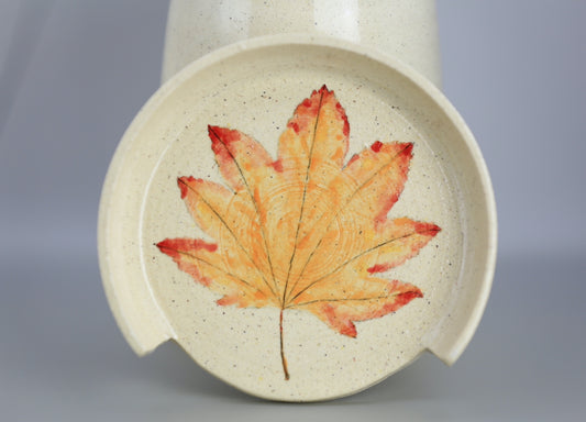 Ceramic spoon rest with handpainted leaf motif