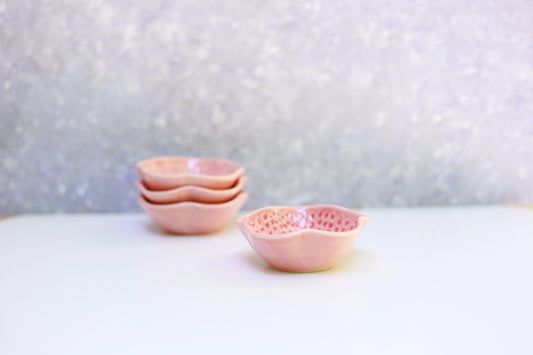 Small porcelain bowl with carvings in coral color