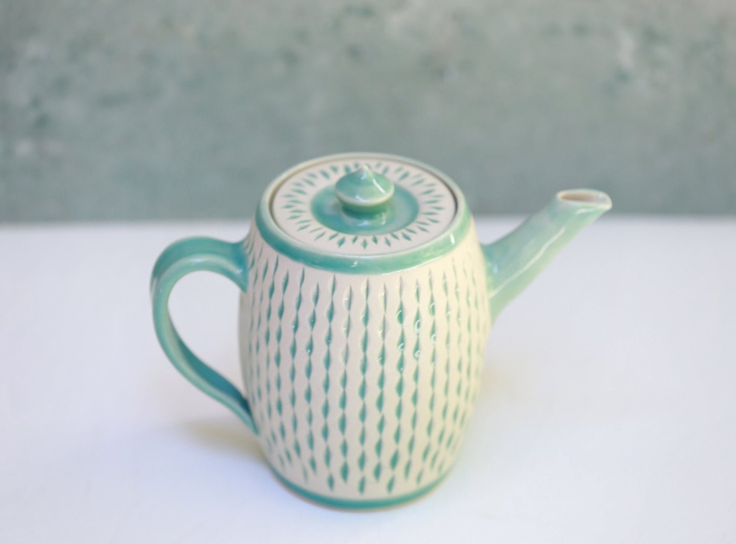 Porcelain teapot with carvings in turquoise