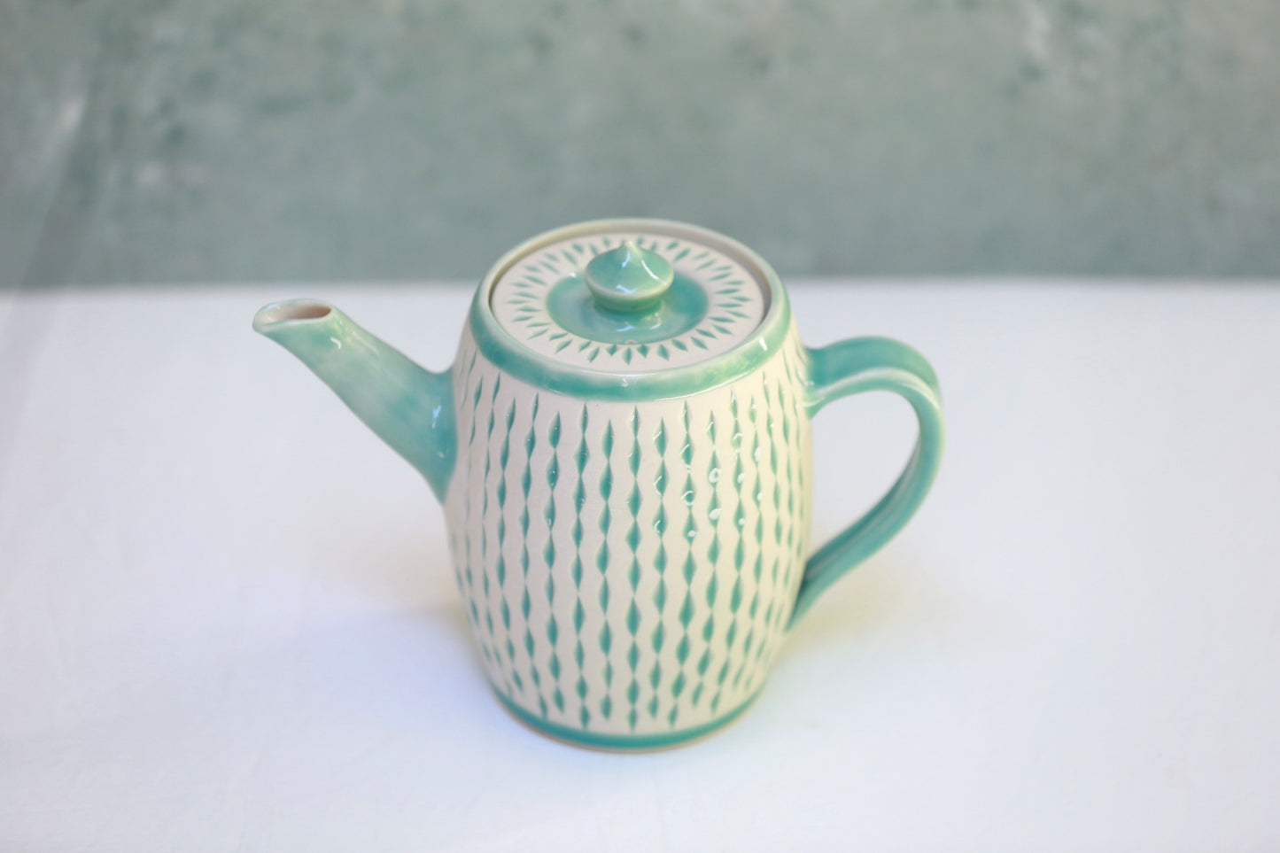 Porcelain teapot with carvings in turquoise