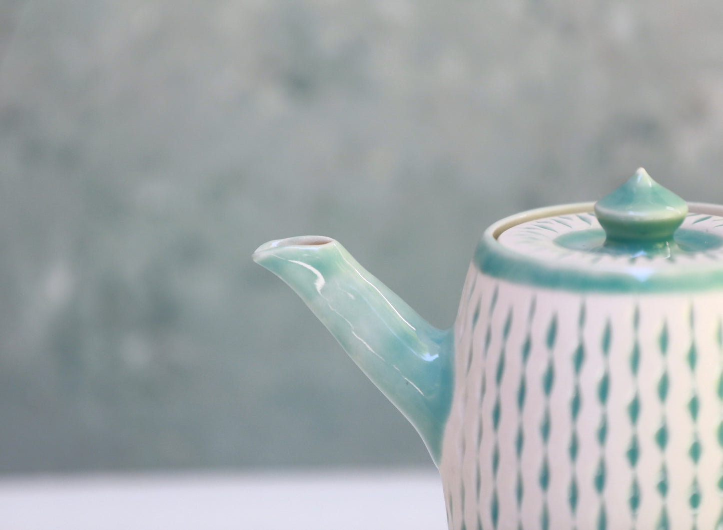 Porcelain teapot with carvings in turquoise