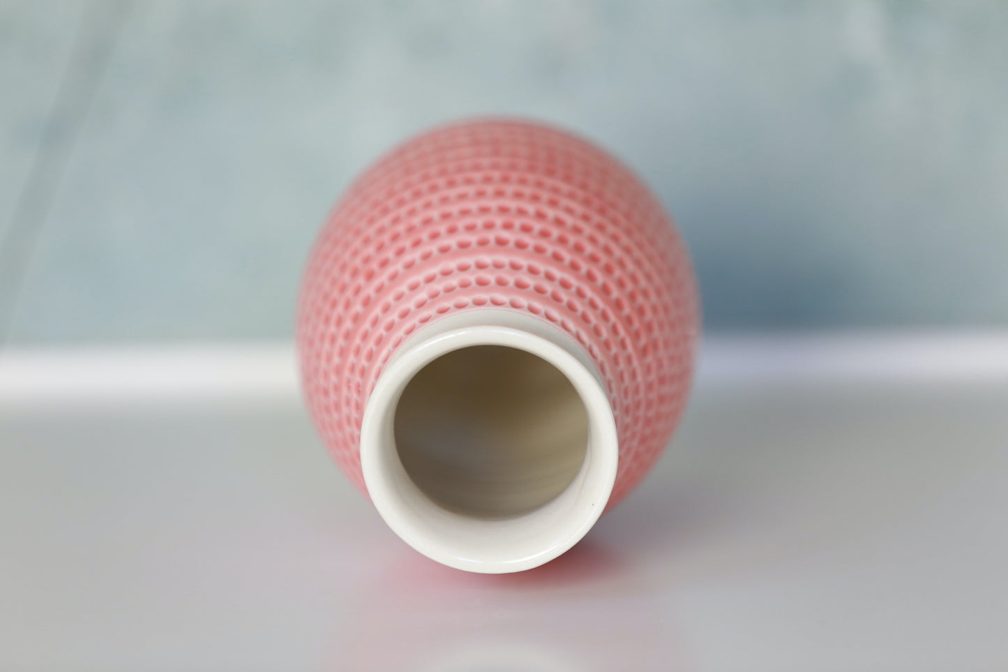 Porcelain Vase with Circle carvings in Coral and White