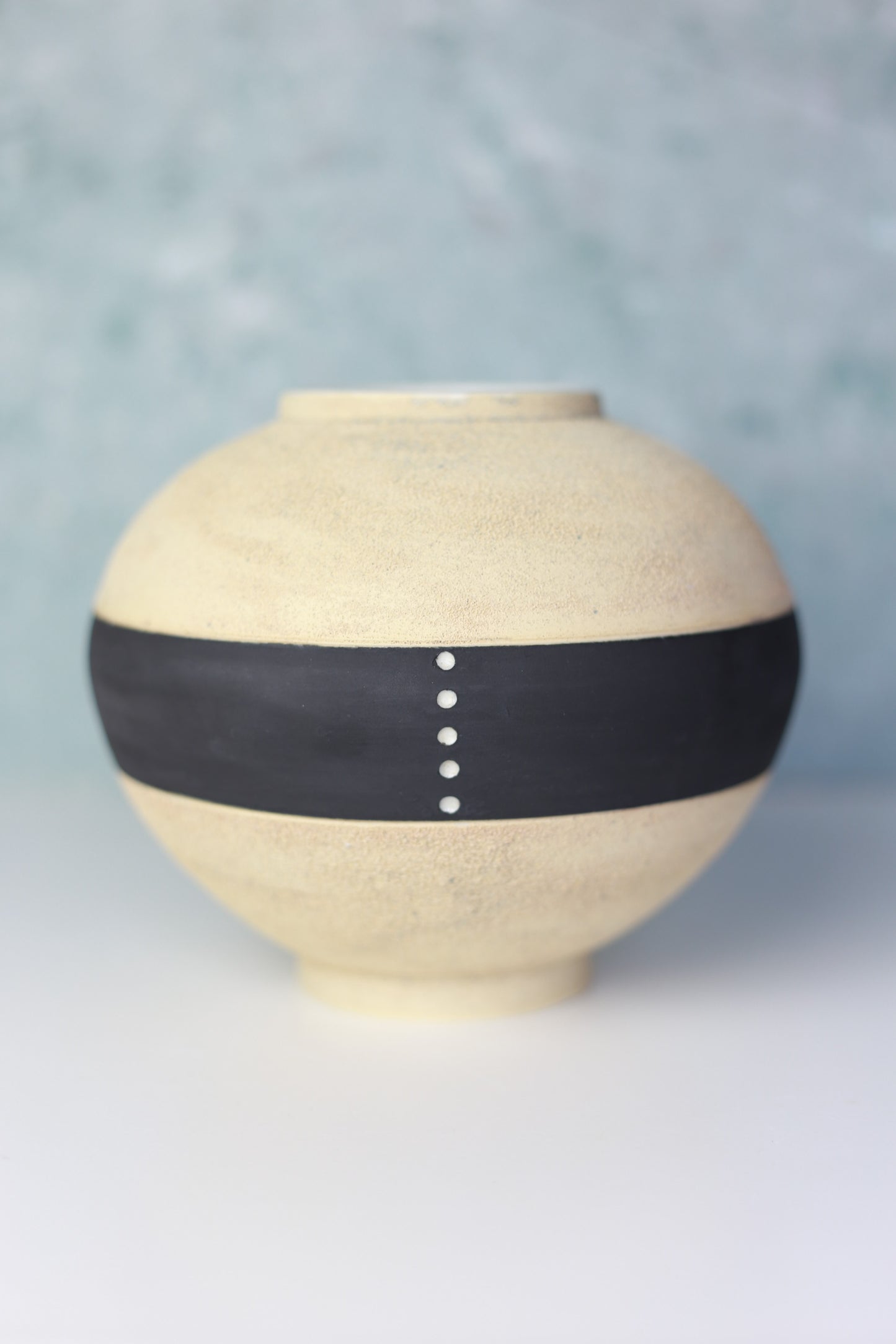 Round Porcelain Vase with Sandy Texture in Beige and Black