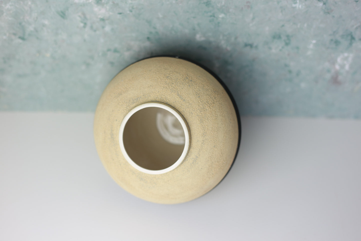 Round Porcelain Vase with Sandy Texture in Beige and Black