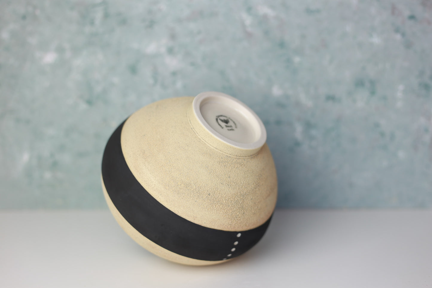 Round Porcelain Vase with Sandy Texture in Beige and Black