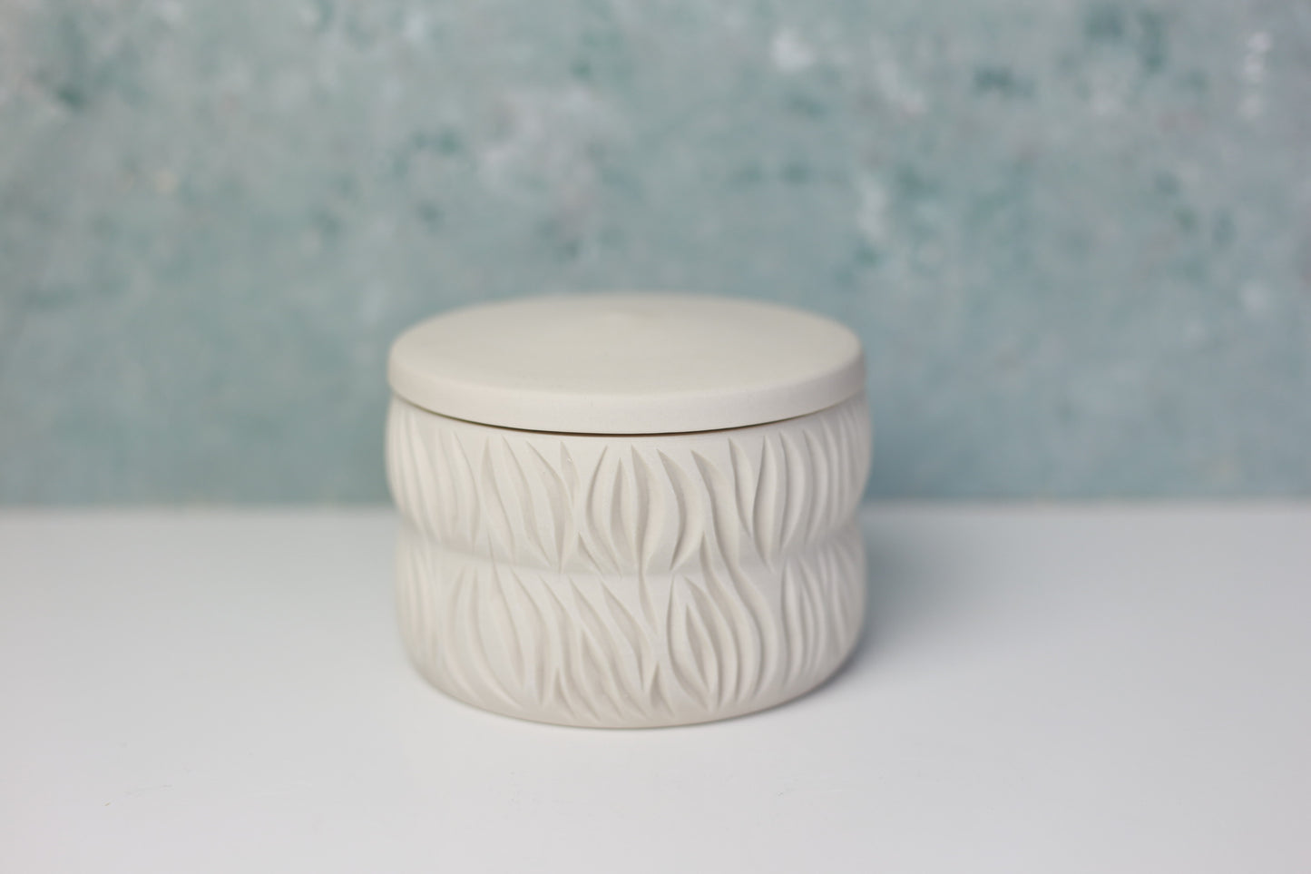 White and Blue Porcelain Jar with Carvings