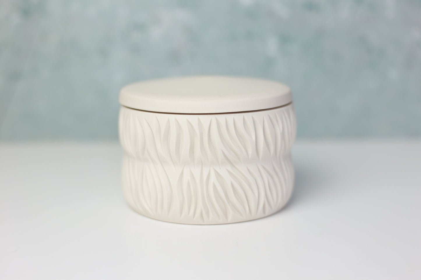 White and Blue Porcelain Jar with Carvings